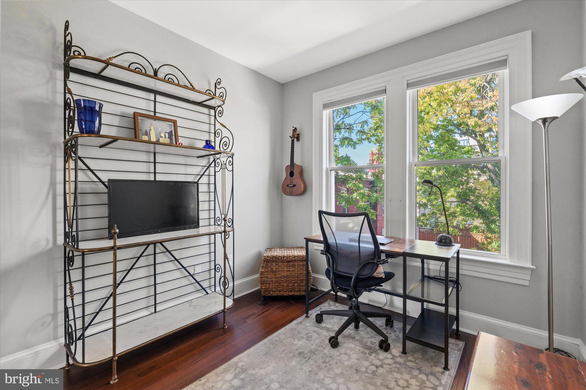 1204 5th Street Northeast Washington, DC 20002 - Photo 25 of 46 a view of a livingroom with workspace and a window