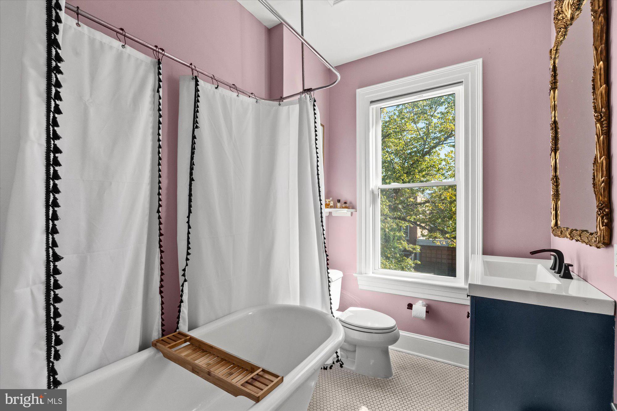 1204 5th Street Northeast Washington, DC 20002 - Photo 27 of 46 a bathroom with a sink toilet and shower