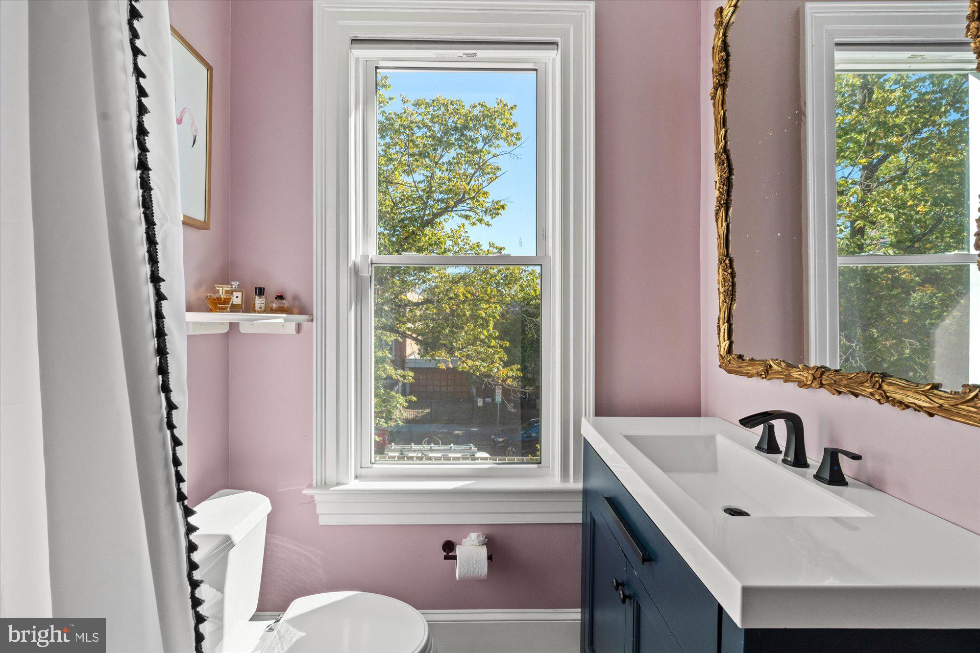 1204 5th Street Northeast Washington, DC 20002 - Photo 28 of 46 a bathroom with a tub sink and mirror
