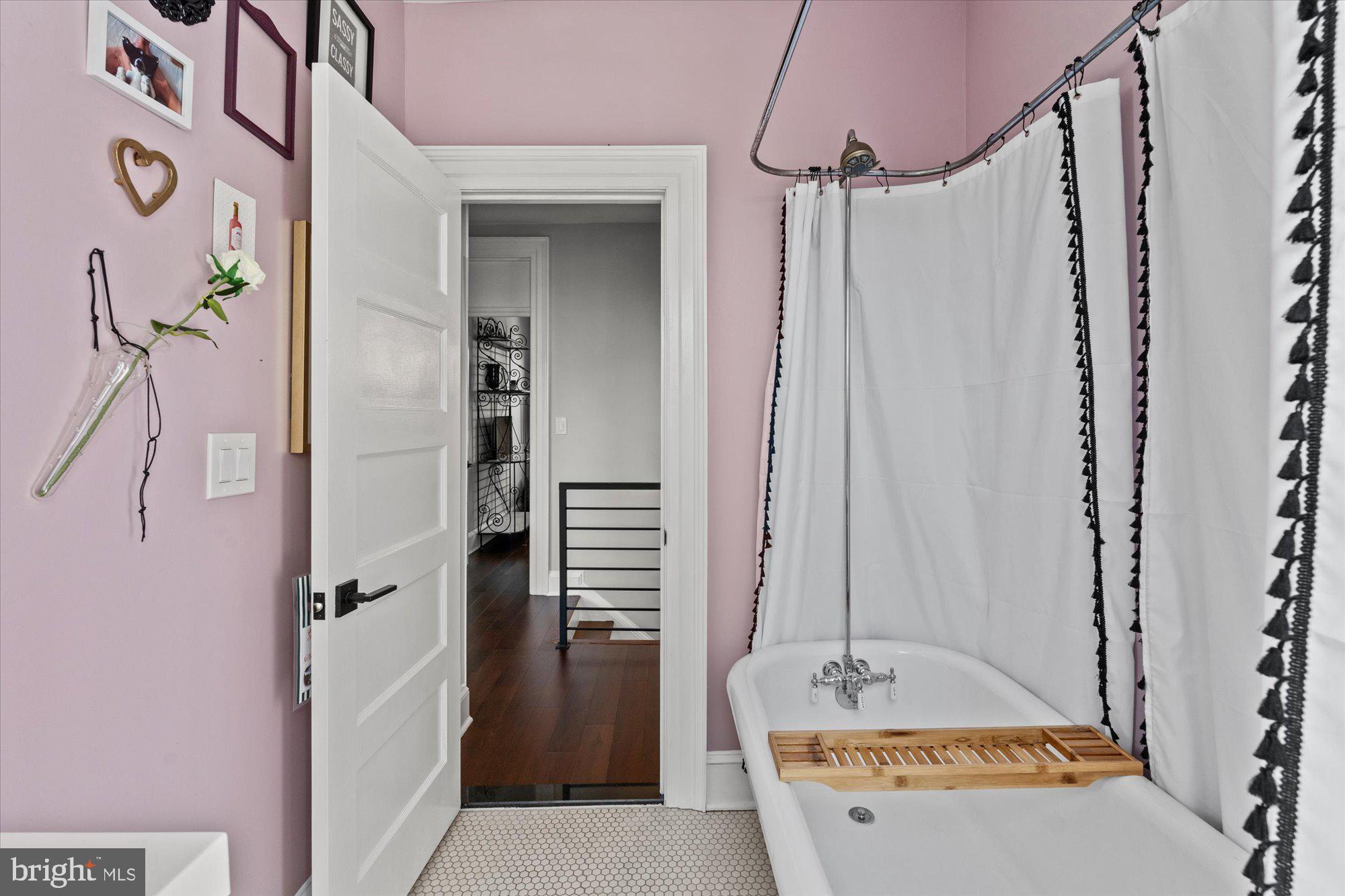 1204 5th Street Northeast Washington, DC 20002 - Photo 29 of 46 a bathroom with a granite countertop sink and a mirror a bathtub