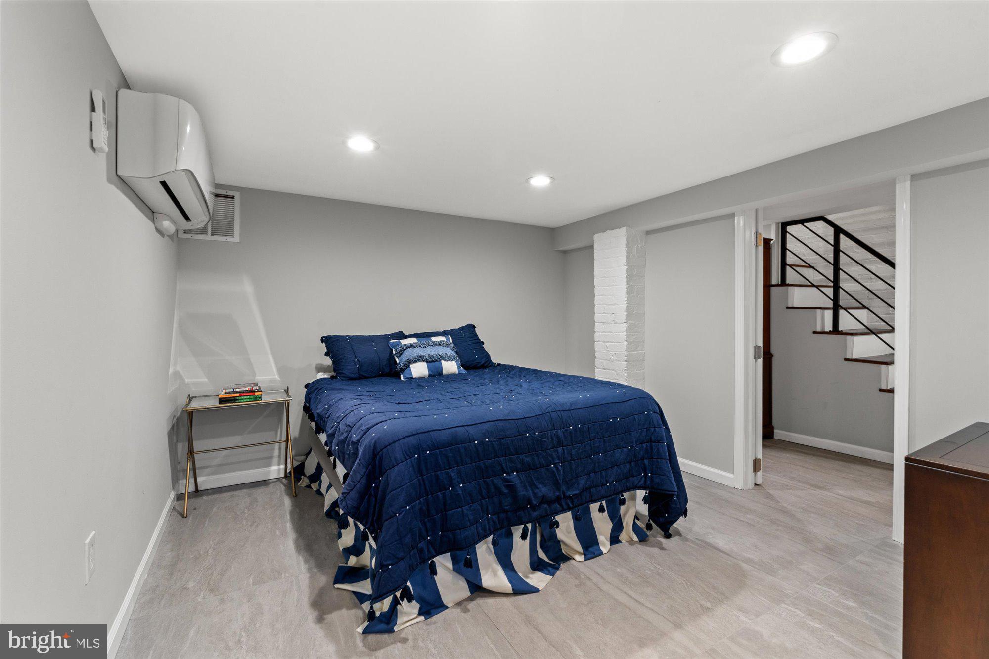 1204 5th Street Northeast Washington, DC 20002 - Photo 30 of 46 a bed sitting in a room next to a window