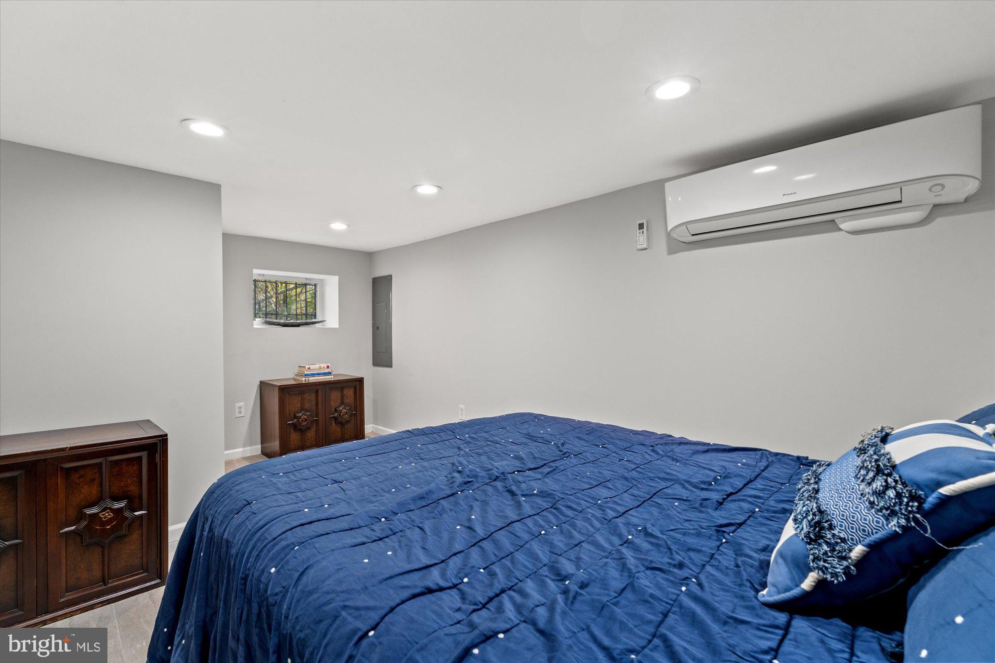 1204 5th Street Northeast Washington, DC 20002 - Photo 32 of 46 a bedroom with a bed and a tv