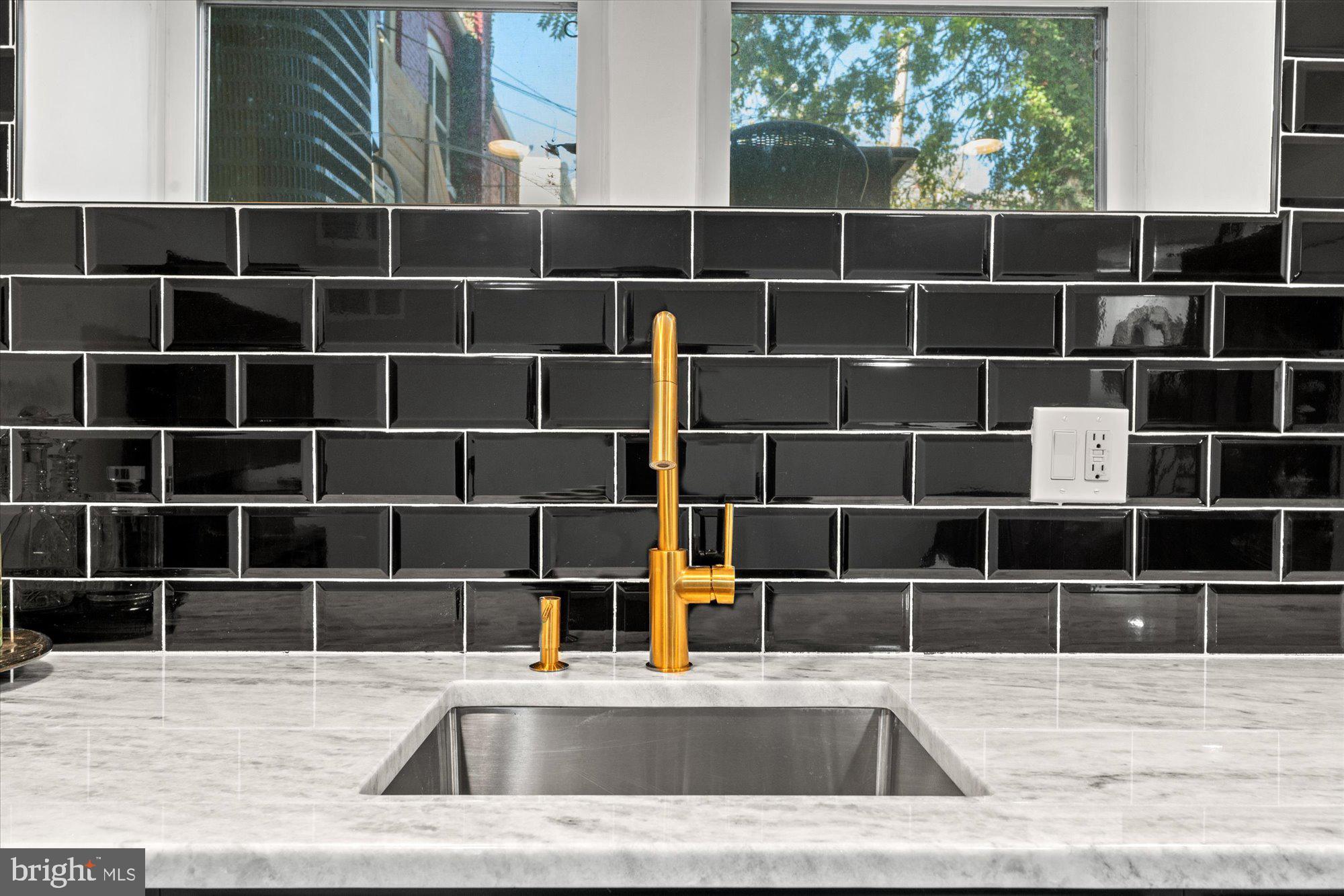 1204 5th Street Northeast Washington, DC 20002 - Photo 38 of 46 a view of a kitchen with a sink and a large window