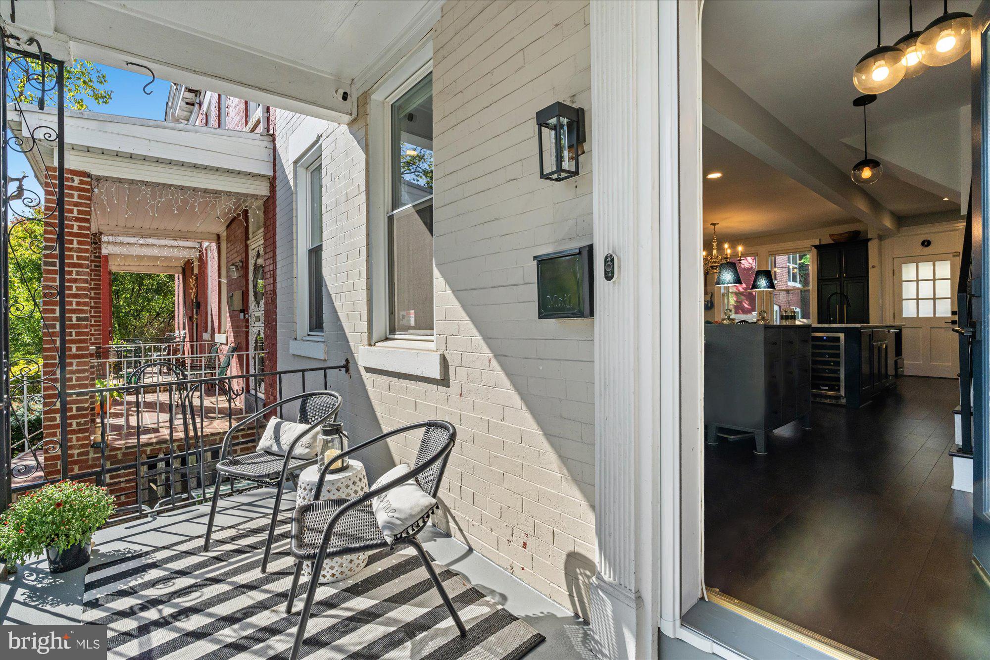 1204 5th Street Northeast Washington, DC 20002 - Photo 4 of 46 a view of a hallway with wooden floor and potted plants