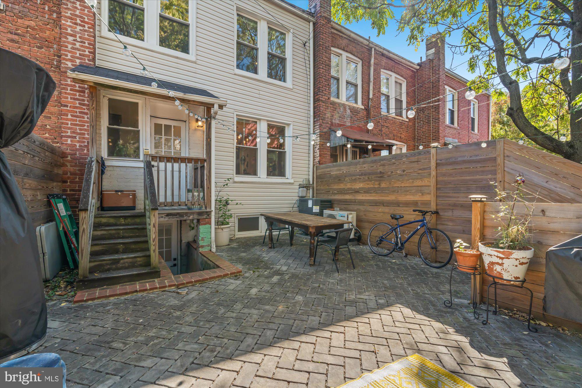 1204 5th Street Northeast Washington, DC 20002 - Photo 41 of 46 a view of a brick building with a bench in patio