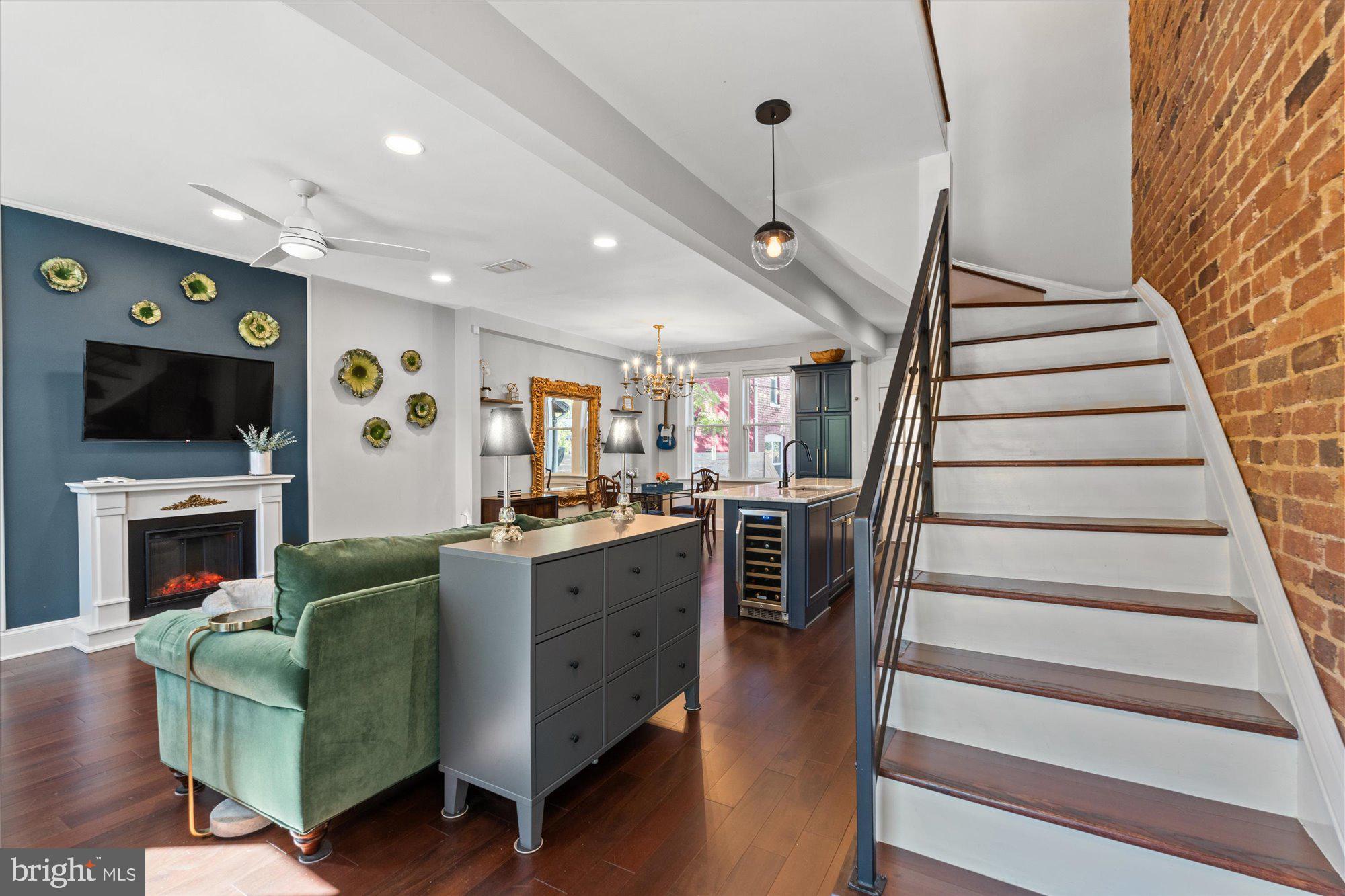 1204 5th Street Northeast Washington, DC 20002 - Photo 5 of 46 a living room with furniture and a fireplace
