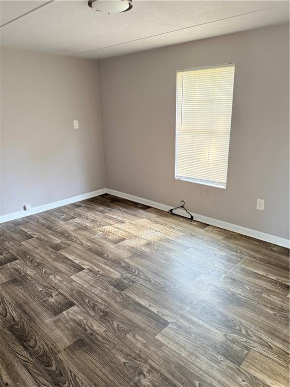 30 Winston Way Hampton, GA 30228 - Photo 5 of 7 an empty room with a window