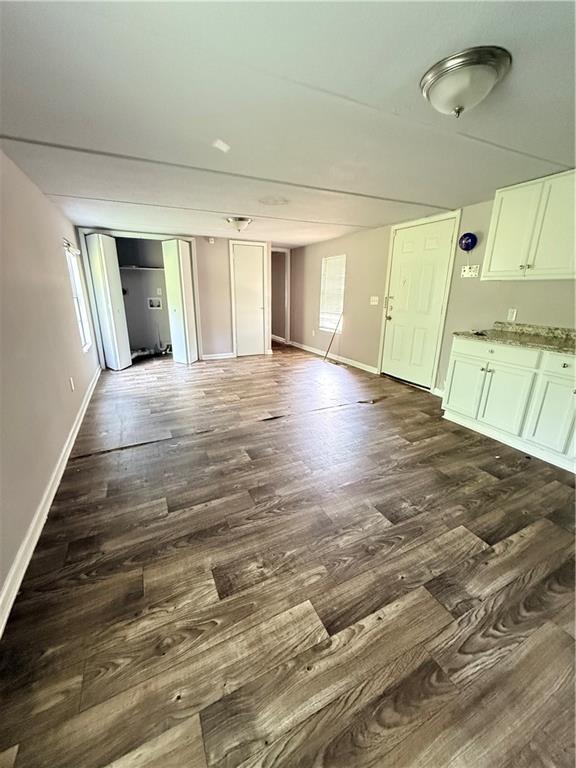 30 Winston Way Hampton, GA 30228 - Photo 7 of 7 an empty room with wooden floor and windows