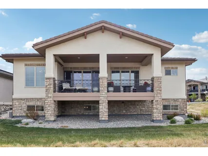 a view of a house with a outdoor seating