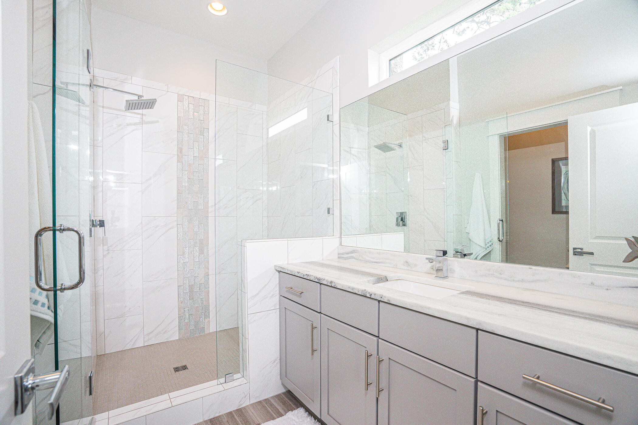 31 Conscience Way Santa Rosa Beach, FL 32459 - Photo 31 of 70 a bathroom with a shower sink vanity and mirror