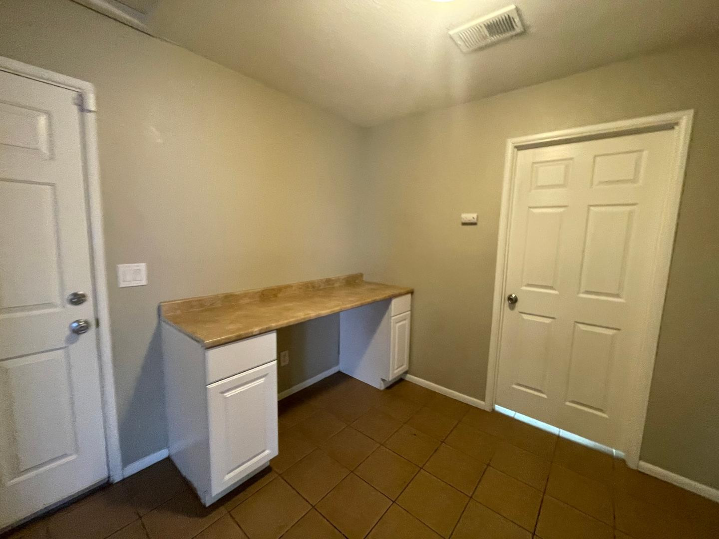 10902 West Montecito Avenue Phoenix, AZ 85037 - Photo 19 of 22 a room with storage and utility