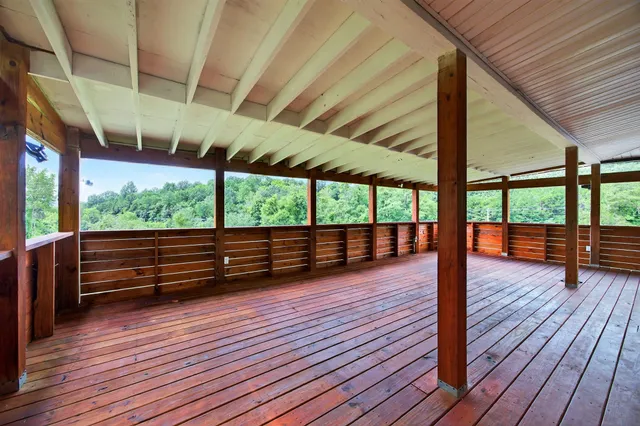 a view of porch with deck and wooden floor