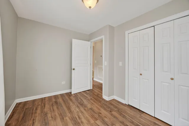 a bedroom with a bed and a fireplace