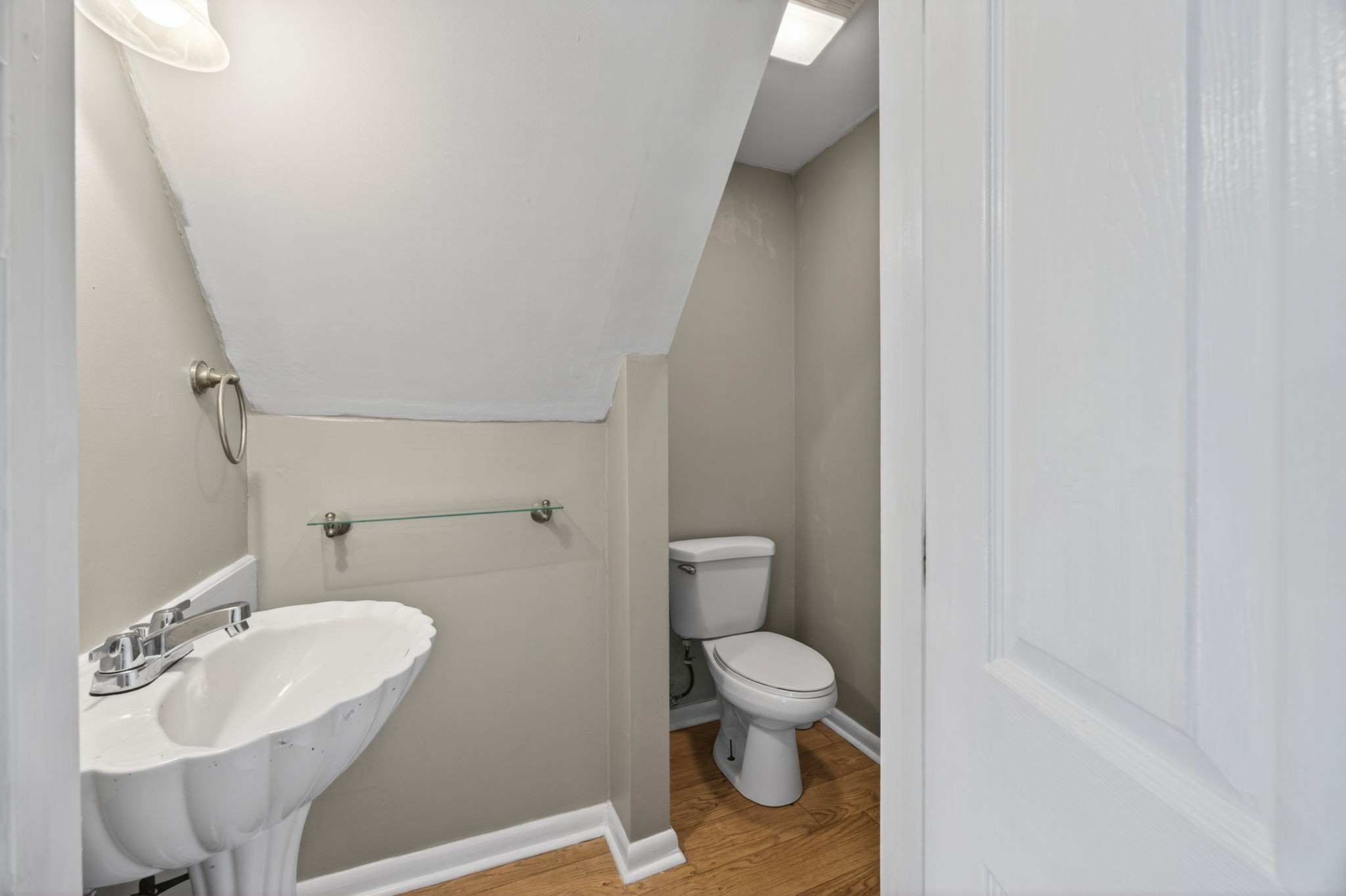 3203 Statesville Road Watertown, TN 37184 - Photo 31 of 56 a bathroom with a toilet sink and mirror