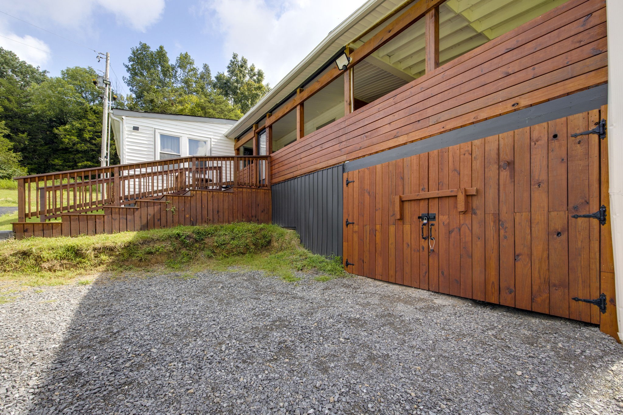 3203 Statesville Road Watertown, TN 37184 - Photo 4 of 56 a view of backyard with small cabin and wooden fence