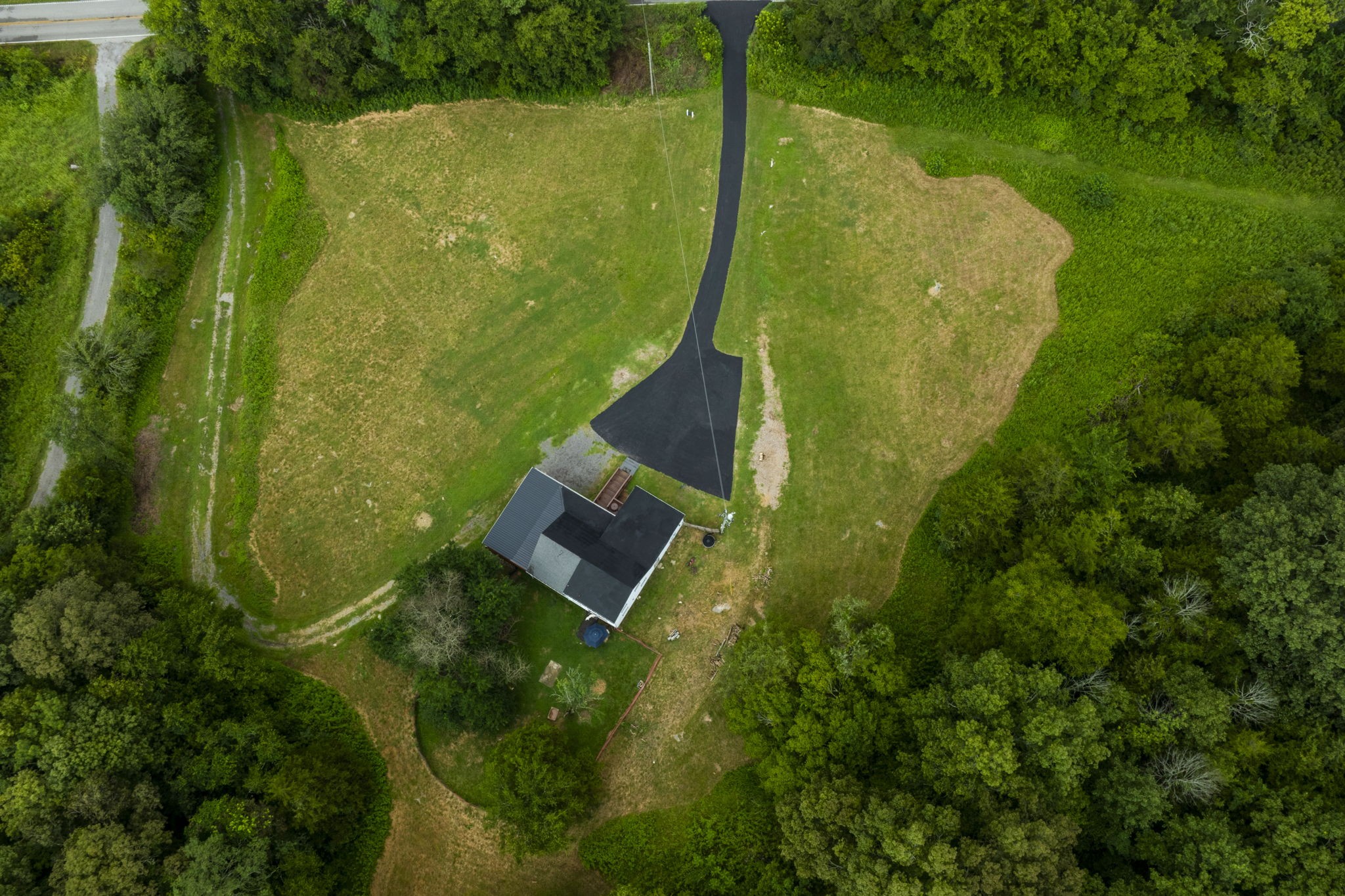 3203 Statesville Road Watertown, TN 37184 - Photo 41 of 56 an aerial view of a residential houses with outdoor space and trees all around