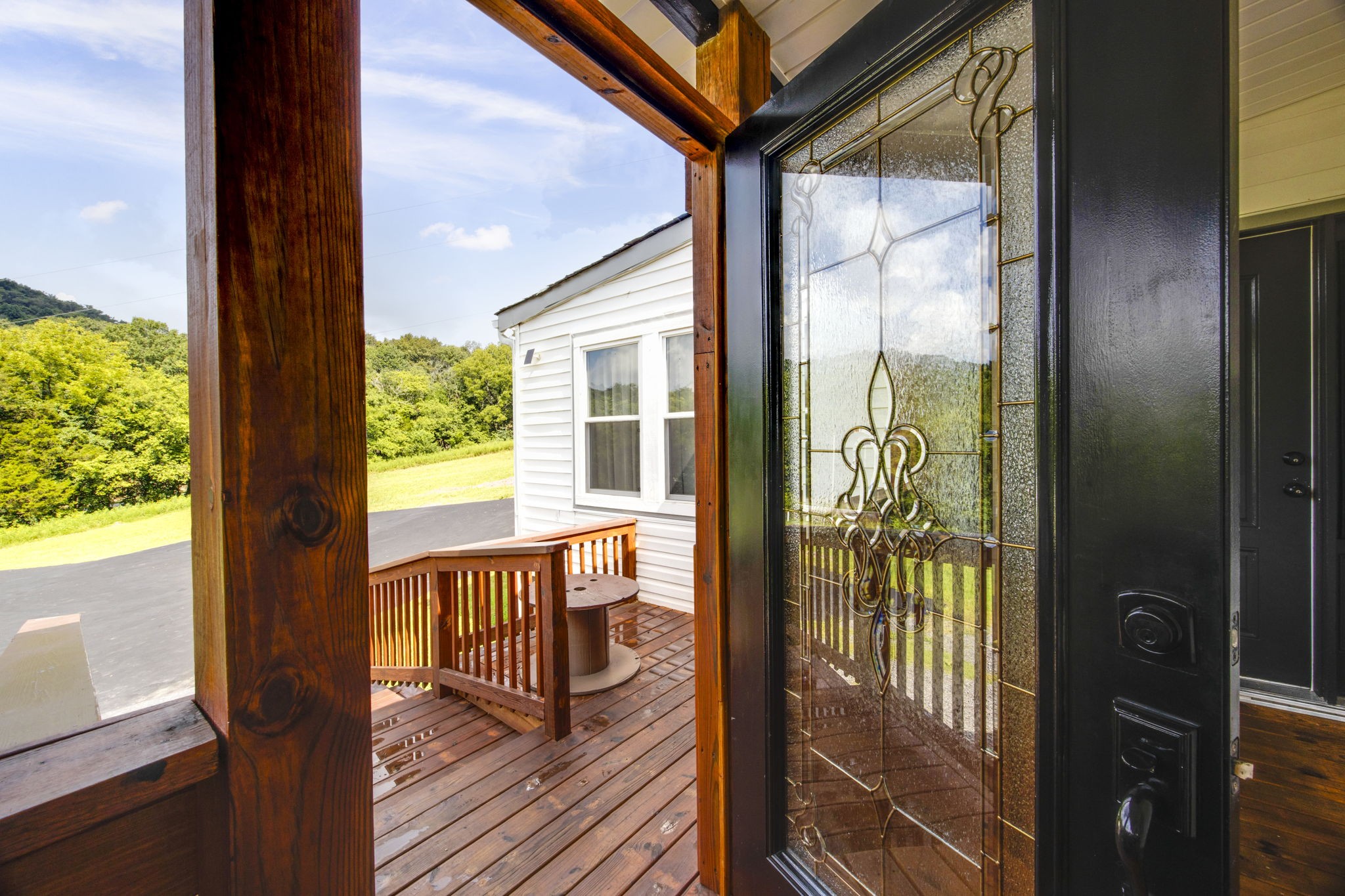 3203 Statesville Road Watertown, TN 37184 - Photo 8 of 56 a view of a porch with wooden floor and furniture