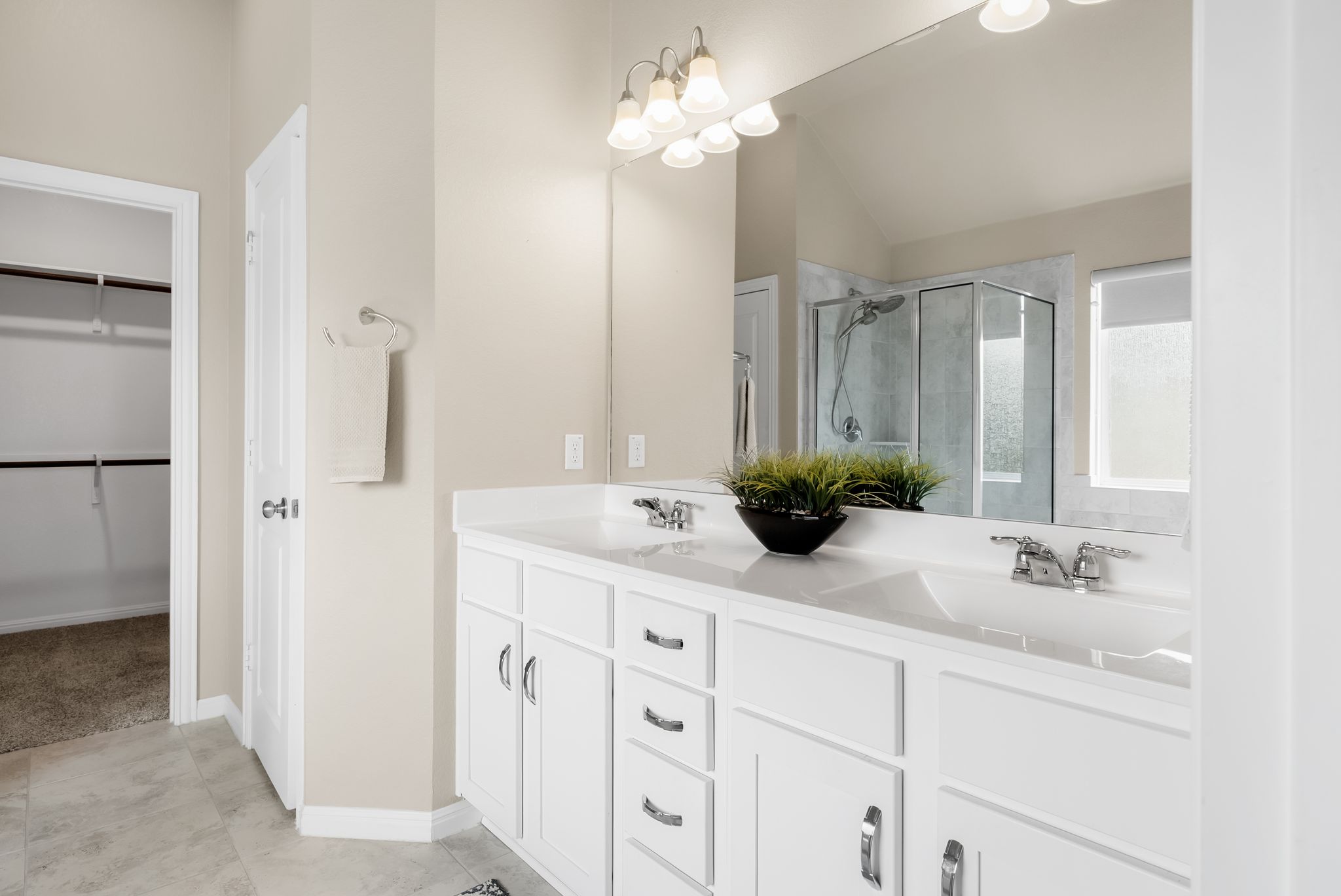 300 Prato Place Georgetown, TX 78628 - Photo 19 of 40 Double vanity with ample storage and bright lighting elevates everyday routines.