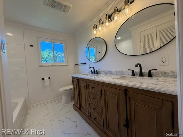 971 Canterbury Road Grosse Pointe, MI 48236 - Photo 25 of 30 Dual vanity with a stone countertop and integrated sinks, wood-finish cabinetry, black fixtures, and a tiled bathtub surround