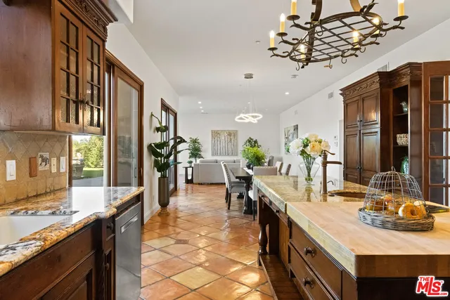 a living room with furniture potted plant and a window