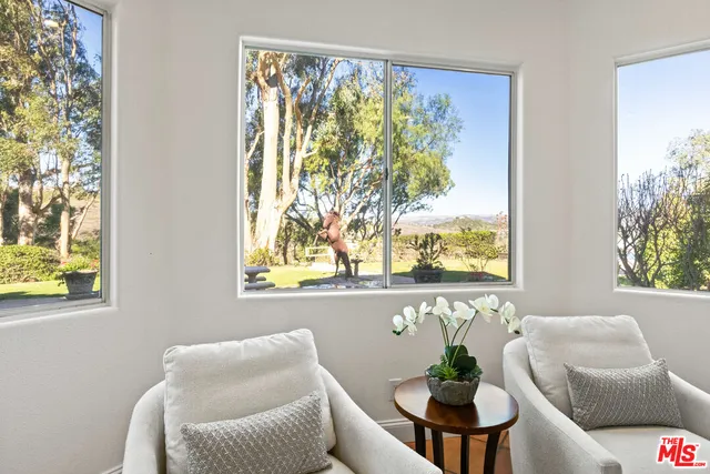 a spacious bathroom with a bathtub sink and mirror