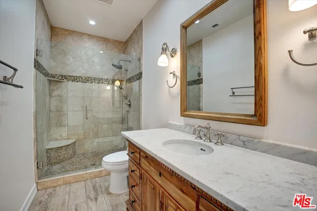 a view of a house with backyard sitting area and swimming pool