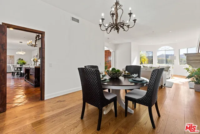 a kitchen with a refrigerator a sink and a counter top space