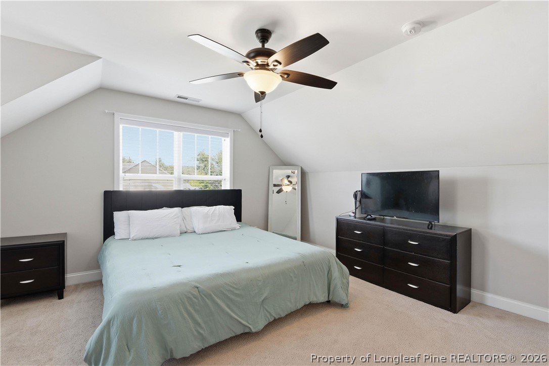 140 Birch Avenue Spring Lake, NC 28390 - Photo 49 of 49 a bedroom with a bed and a tv