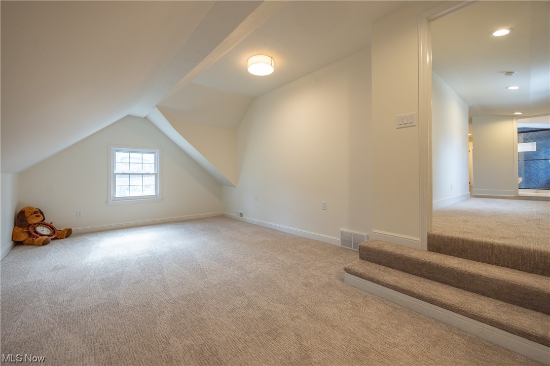 32887 Cedar Road Mayfield Heights, OH 44124 - Photo 27 of 44 Bonus room featuring vaulted ceiling and light carpet