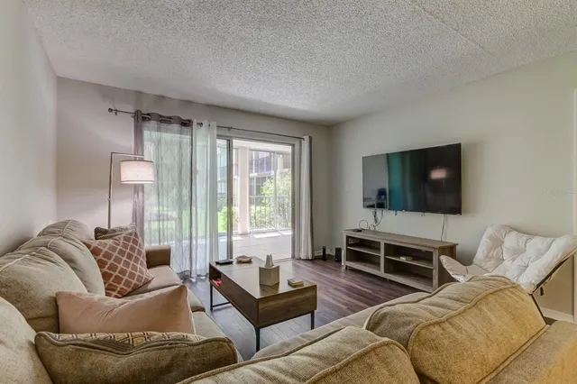 a living room with furniture and a large window