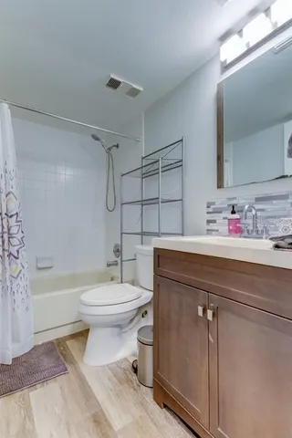 a view of a swimming pool and trees in the background