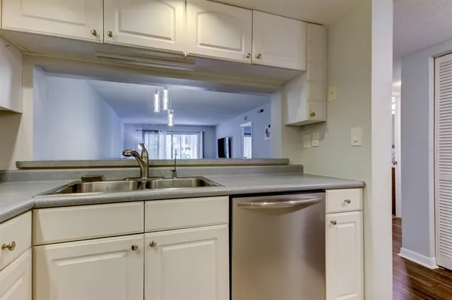 a kitchen with a sink and cabinets