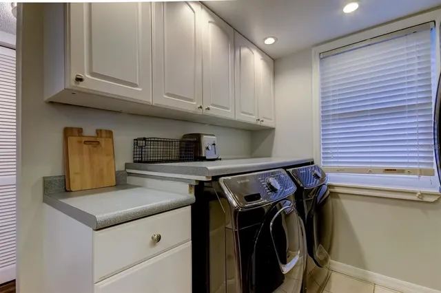 a kitchen with stainless steel appliances granite countertop a stove and a microwave