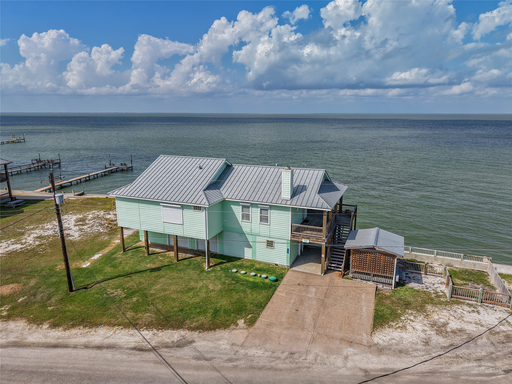 740 Copano Cove Road Rockport, TX 78382 - Photo 10 of 35 a balcony with table and chairs