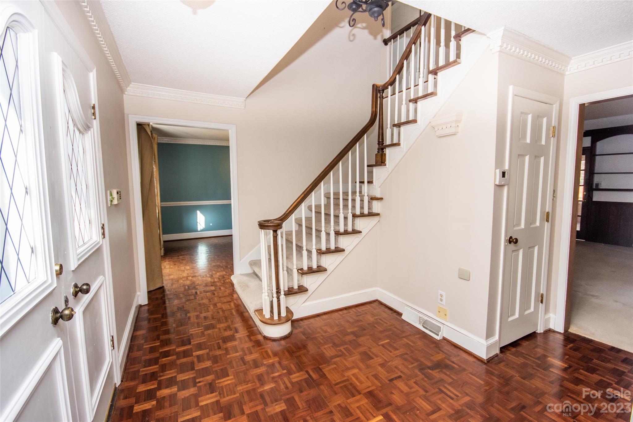 321 St Andrews Road Statesville, NC 28625 - Photo 2 of 19 a view of a hallway with wooden floor and staircase