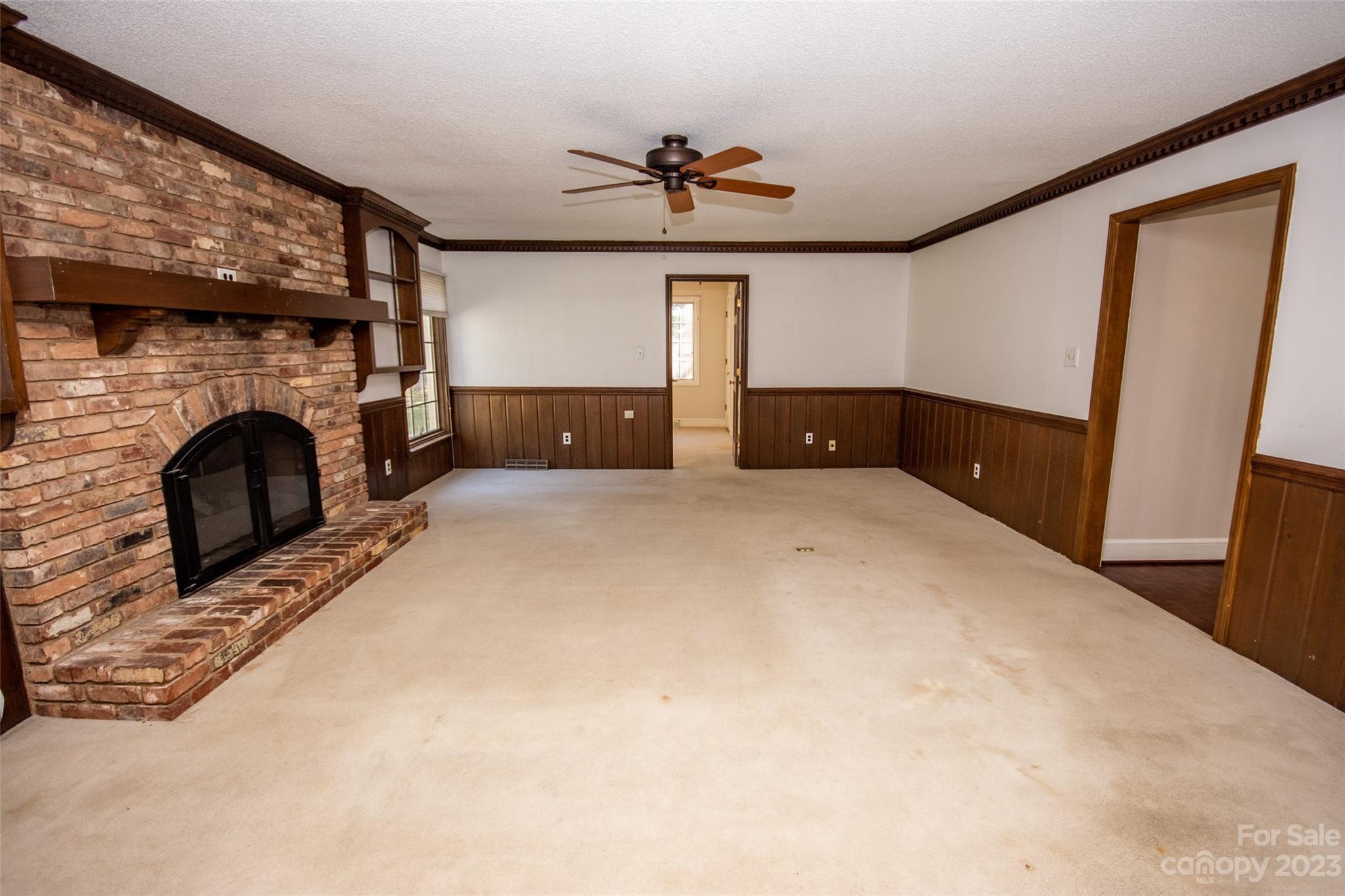 321 St Andrews Road Statesville, NC 28625 - Photo 3 of 19 a view of empty room with fireplace and fan