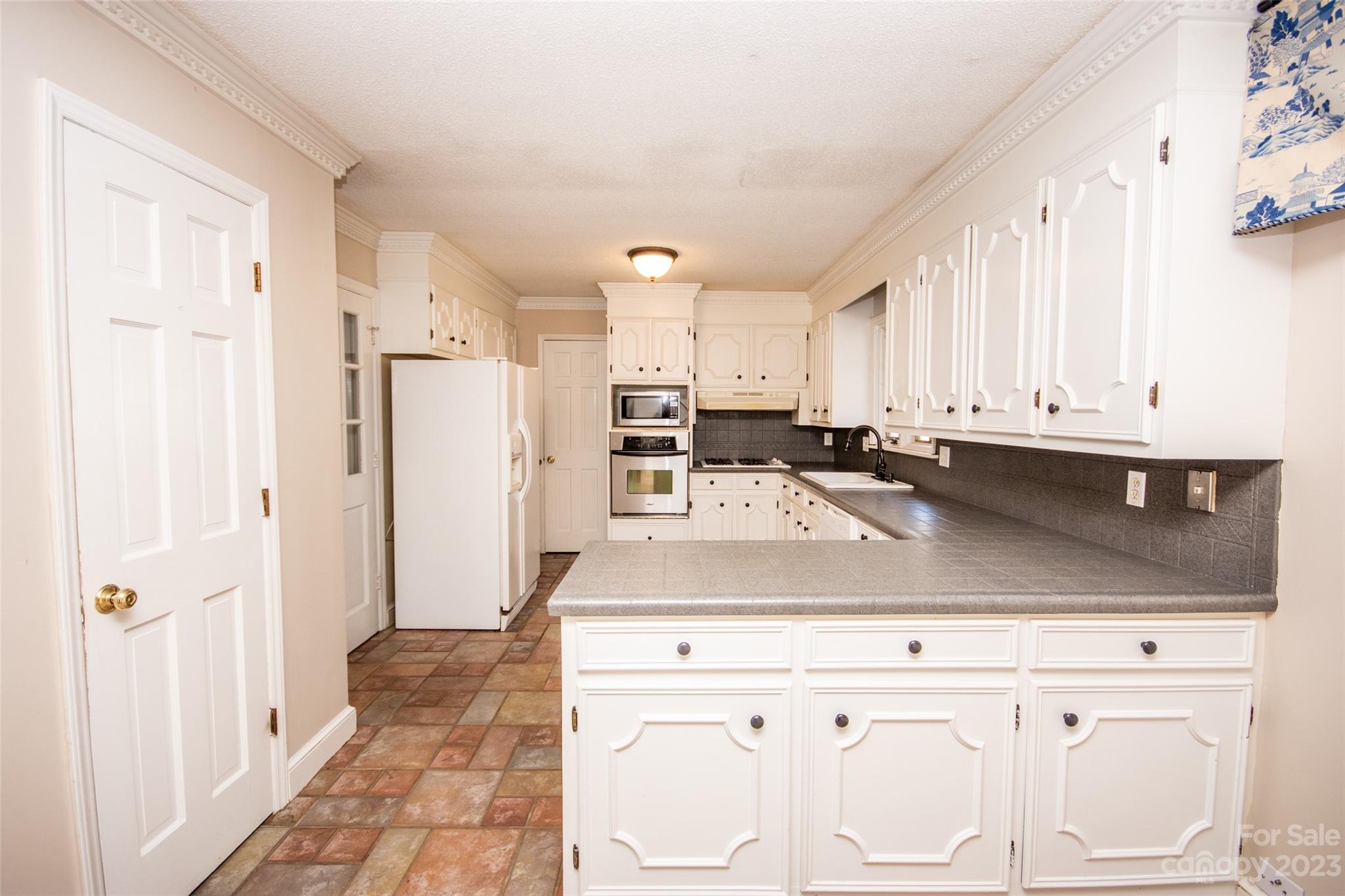 321 St Andrews Road Statesville, NC 28625 - Photo 4 of 19 a view of a kitchen with kitchen island a sink stainless steel appliances and cabinets