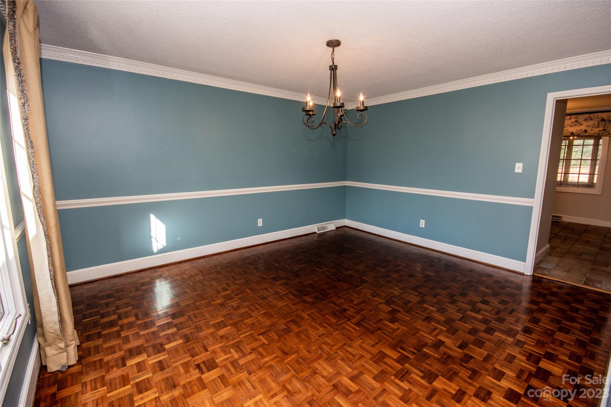 321 St Andrews Road Statesville, NC 28625 - Photo 6 of 19 a view of a room with wooden floor and chandelier