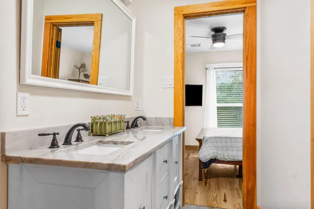 a view of a bathroom with sink and mirror