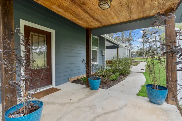 a view of an entryway with wooden floor