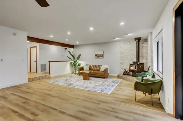 a open kitchen with stainless steel appliances granite countertop a sink and a refrigerator