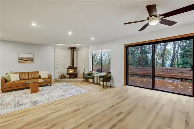 a kitchen with stainless steel appliances granite countertop a refrigerator and a stove top oven