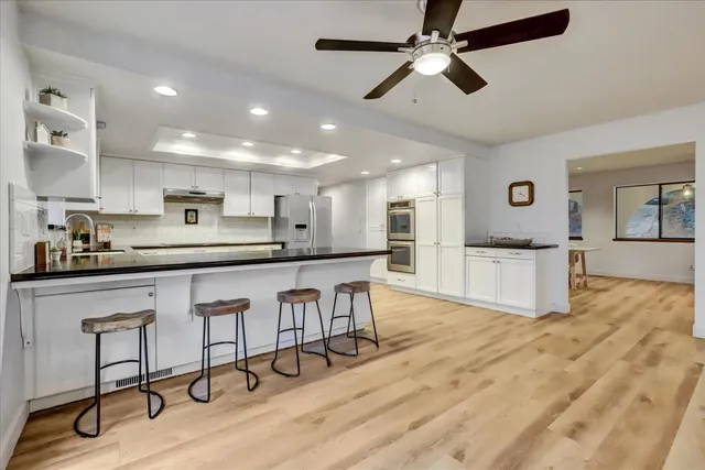 a white toilet sitting next to a bathroom sink