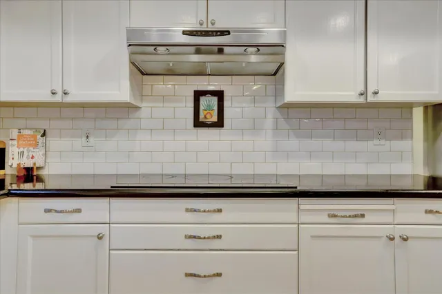 a bedroom with a bed and a mirror