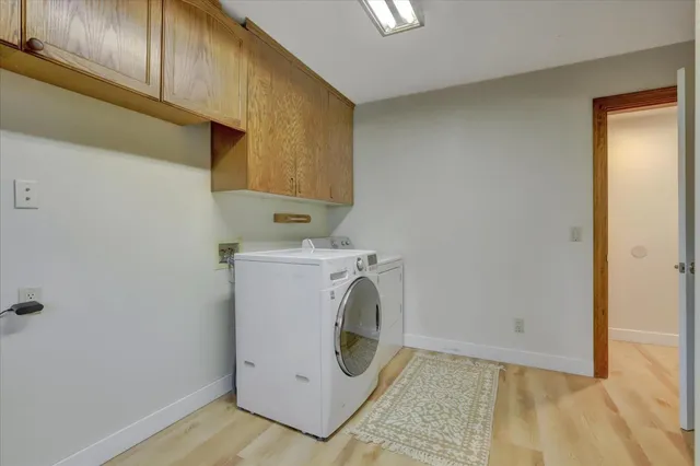 a bedroom with a bed and glass door