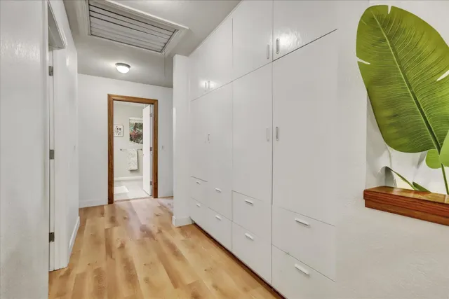 a view of backyard with wooden floor and fence