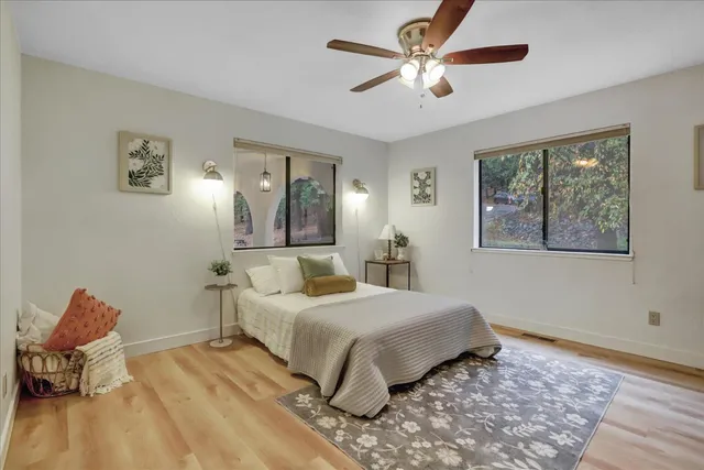 a view of backyard with deck and wooden floor
