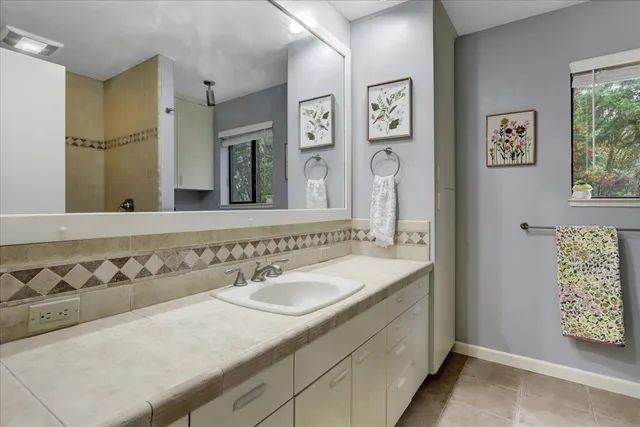 a view of a yard with large trees