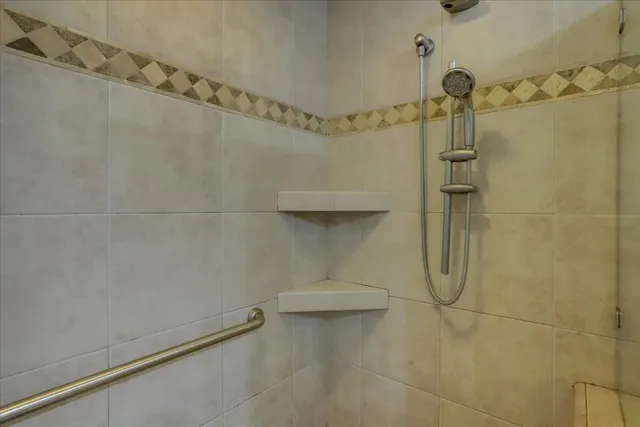 a front view of a house with garden and patio