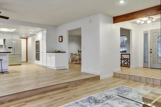 a kitchen with stainless steel appliances granite countertop a refrigerator sink and cabinets